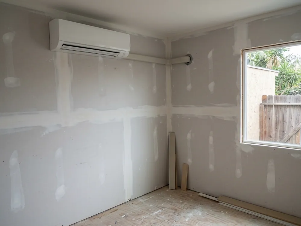 Indoor mini-split in an unfinished room addition.